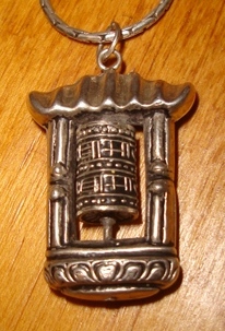 silver prayer wheel necklace - $25